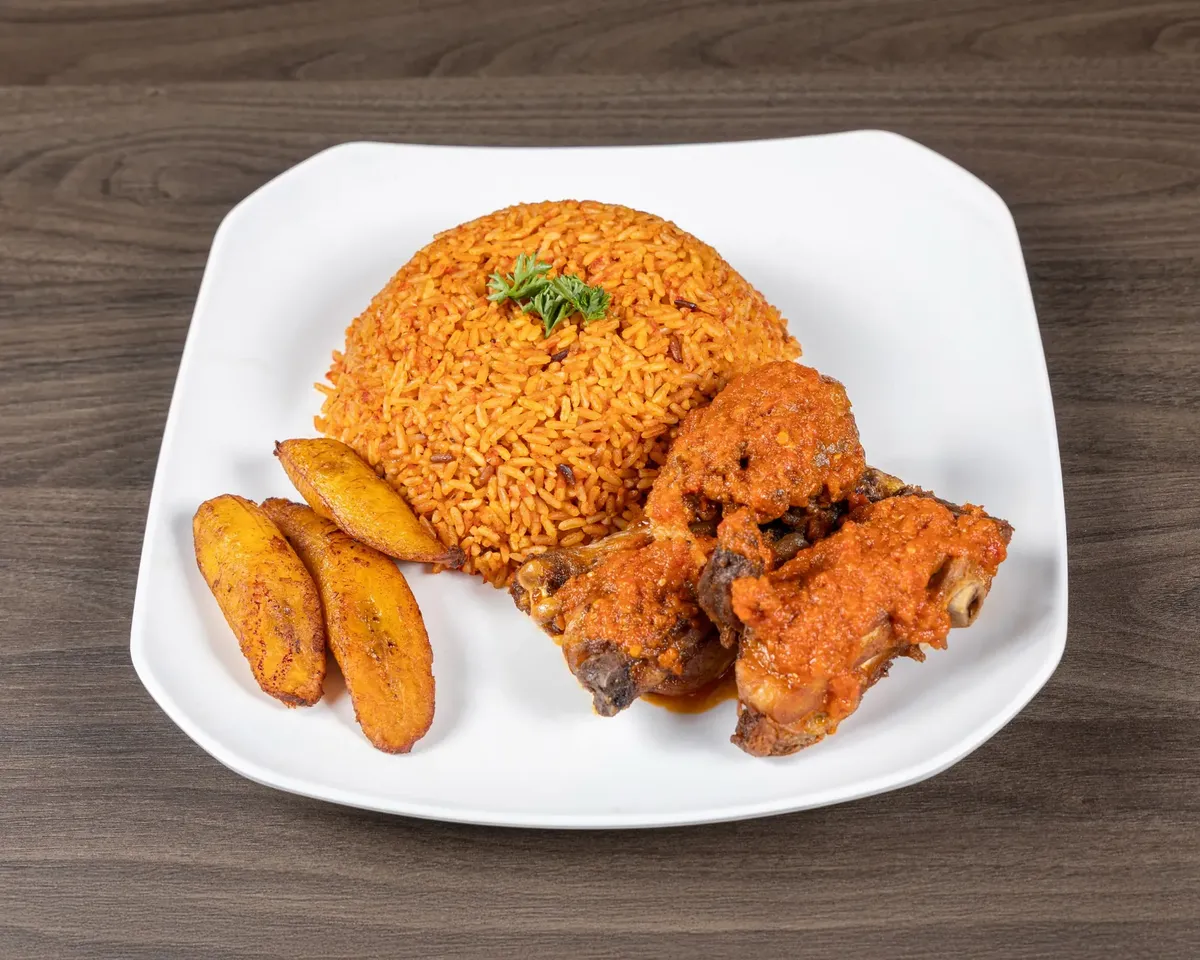 Jollof rice with grilled chicken and fried plantain at M&M African Kitchen & Bar