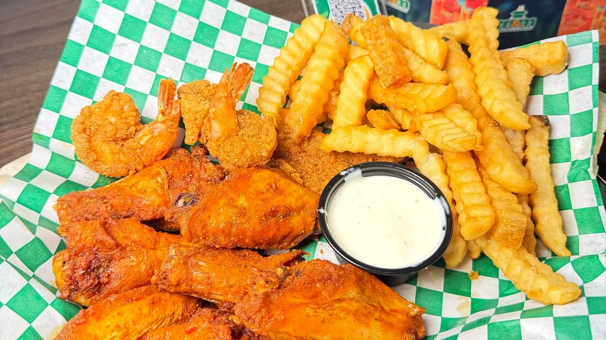 Spicy suya wings, shrimp, and fries at M&M African Kitchen & Bar